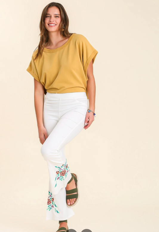 White pants with floral accent